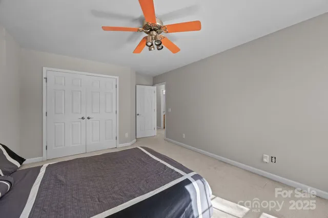 a bathroom with a toilet a sink and a mirror