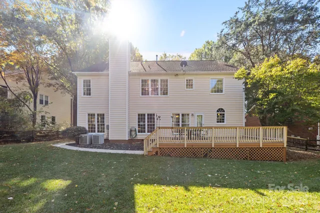 a view of a backyard with swimming pool