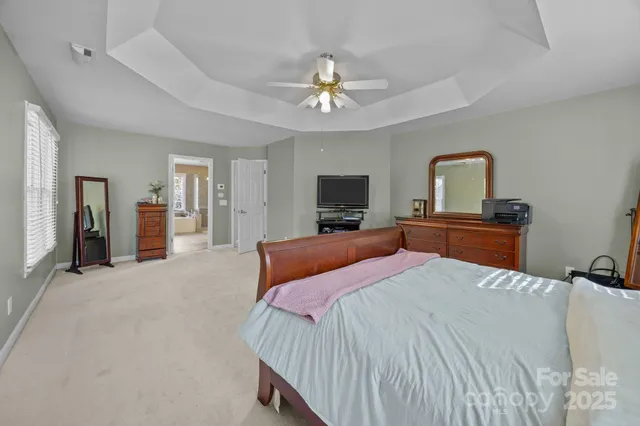 a spacious bathroom with a tub sink shower and mirror