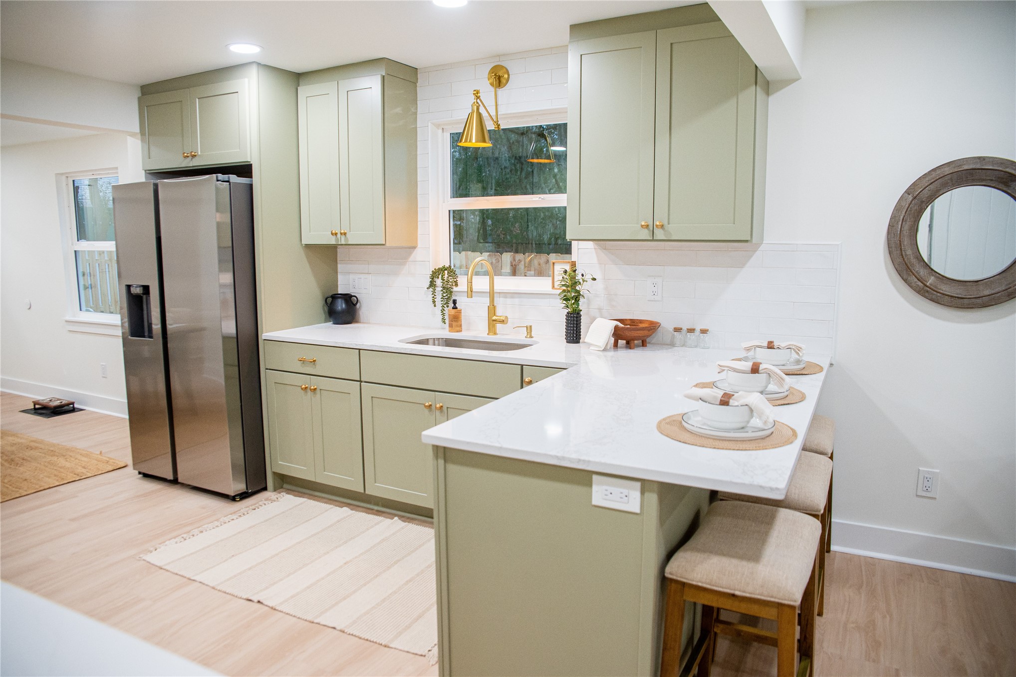 610 Division Street Fernandina Beach, FL 32034 - Photo 14 of 43 a kitchen that has a sink and a refrigerator