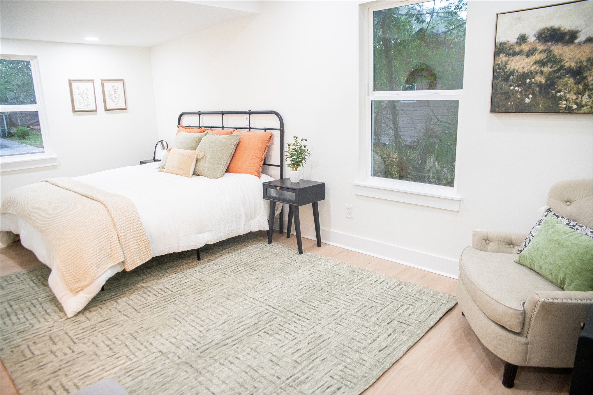 610 Division Street Fernandina Beach, FL 32034 - Photo 25 of 43 a bedroom with a bed and glass window
