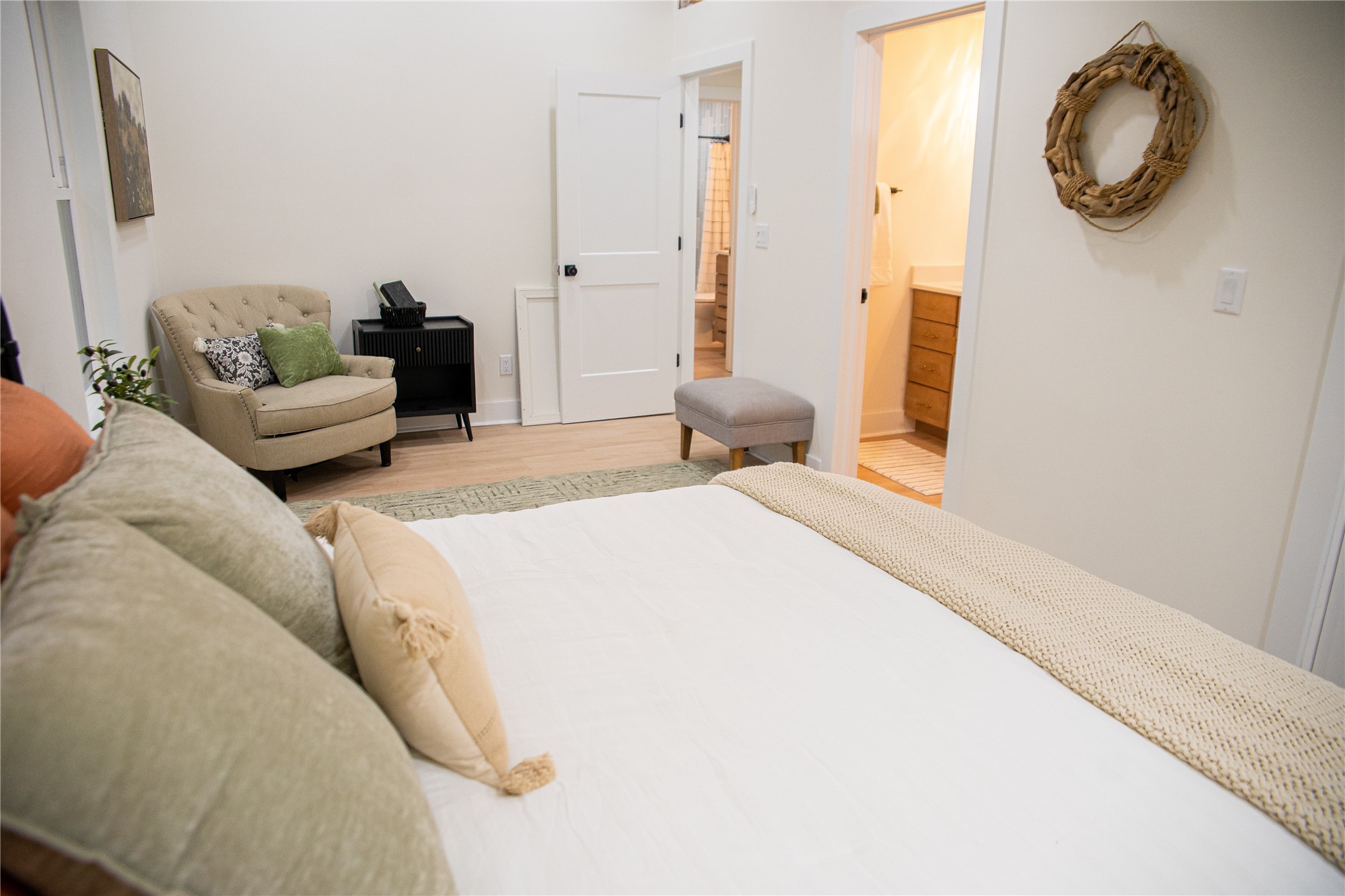 610 Division Street Fernandina Beach, FL 32034 - Photo 27 of 43 a bedroom with a bed and a chandelier