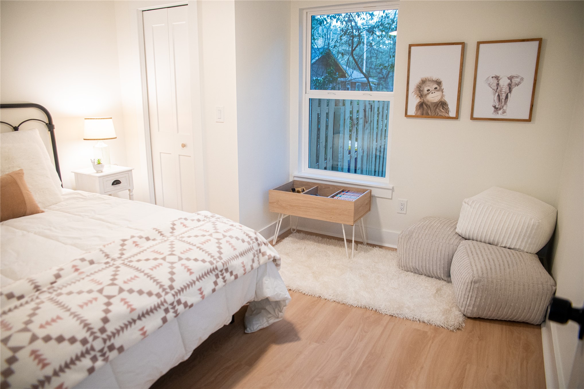 610 Division Street Fernandina Beach, FL 32034 - Photo 36 of 43 a bedroom with a bed and a chair