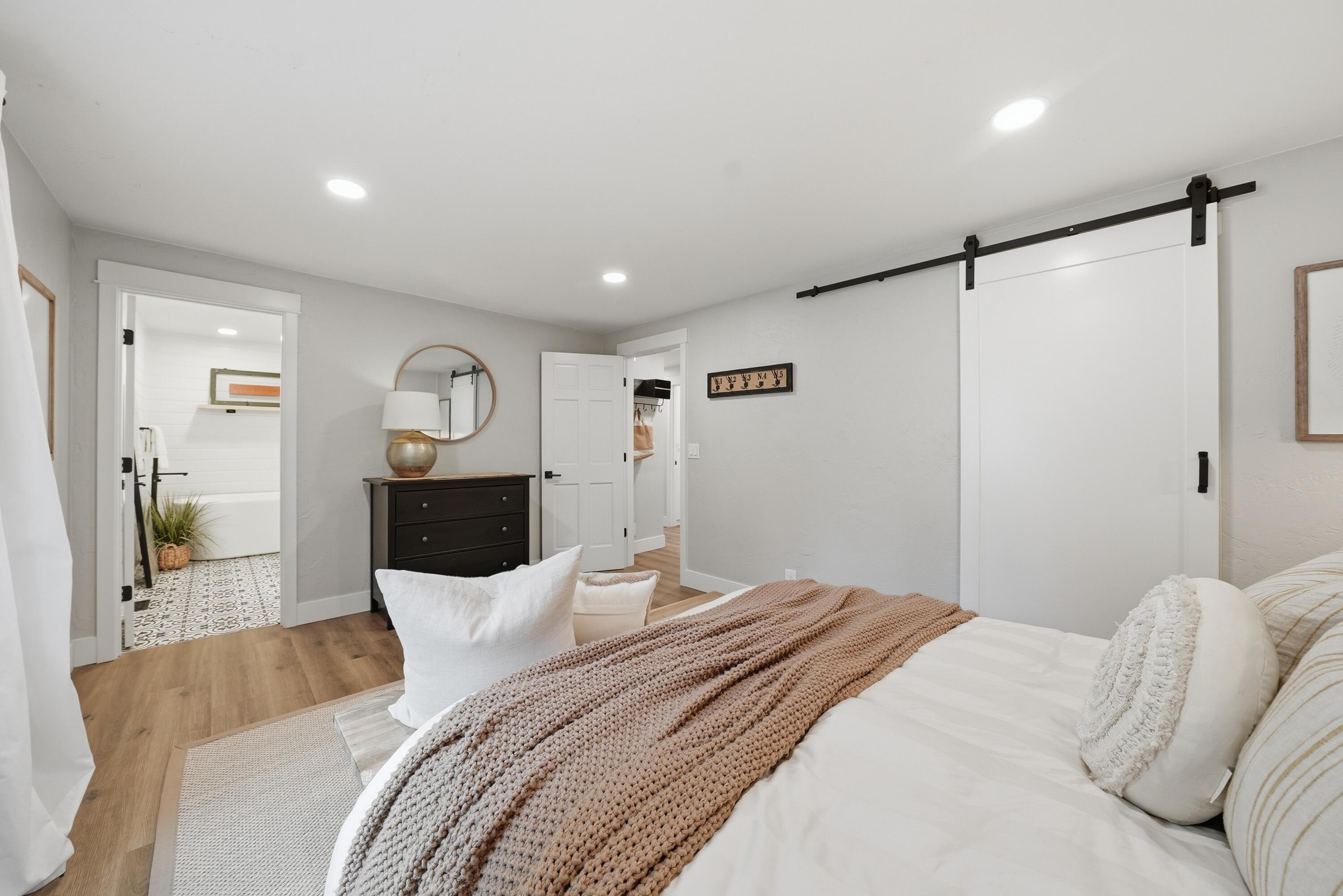 1961 Southwest Knoll Avenue Bend, OR 97702 - Photo 14 of 53 a bedroom with a bed and a mirror