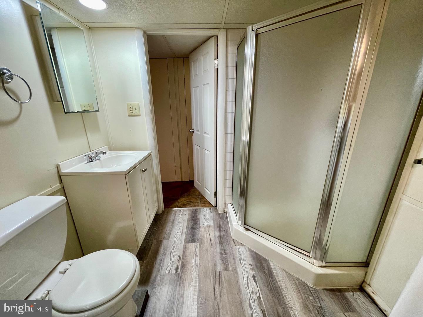 692 Lenni Road Aston, PA 19014 - Photo 20 of 28 a bathroom with a sink a toilet a mirror and shower