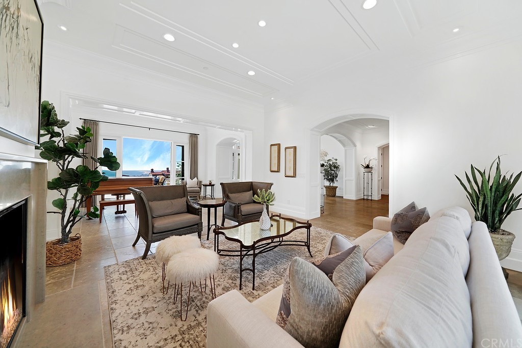 9 Offshore Newport Coast, CA 92657 - Photo 23 of 75 a living room with furniture potted plant and a mirror