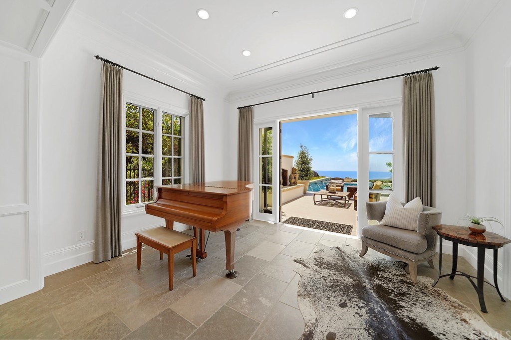 9 Offshore Newport Coast, CA 92657 - Photo 24 of 75 a living room with furniture a rug and a large window
