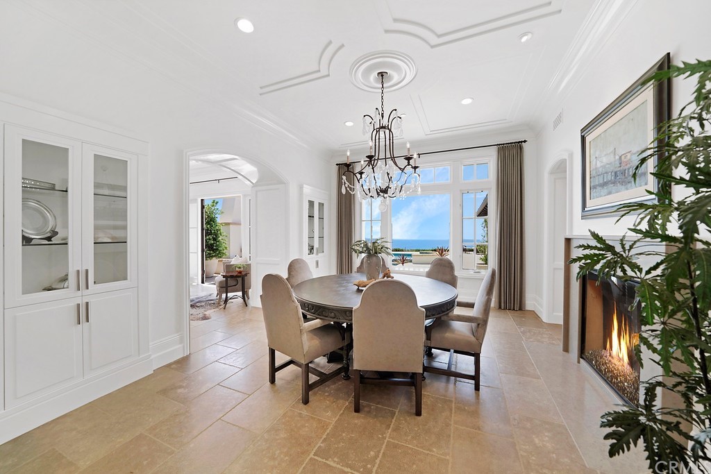 9 Offshore Newport Coast, CA 92657 - Photo 25 of 75 a view of a dining room with furniture and a chandelier