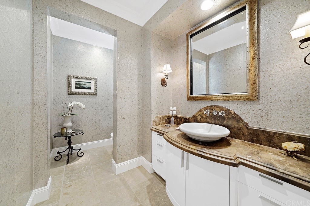 9 Offshore Newport Coast, CA 92657 - Photo 26 of 75 a bathroom with a sink and a mirror