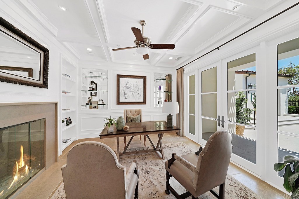 9 Offshore Newport Coast, CA 92657 - Photo 28 of 75 a living room with furniture and a fireplace