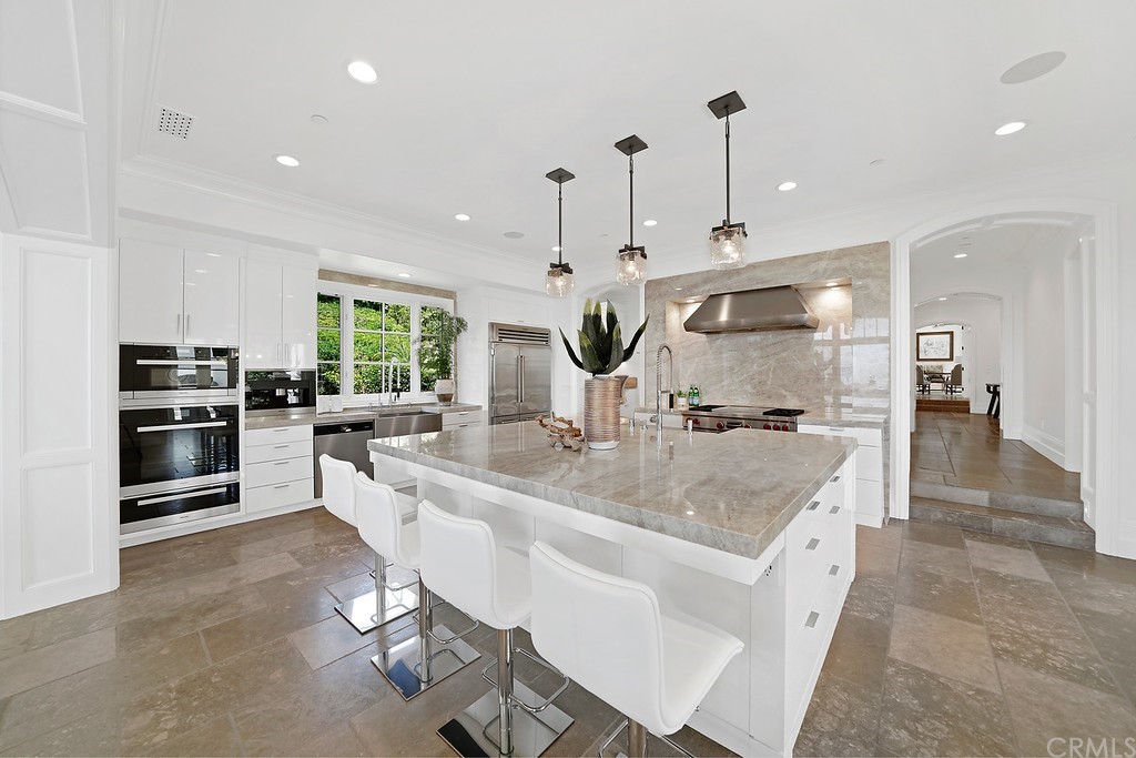 9 Offshore Newport Coast, CA 92657 - Photo 33 of 75 a large kitchen with stainless steel appliances lots of counter space and windows