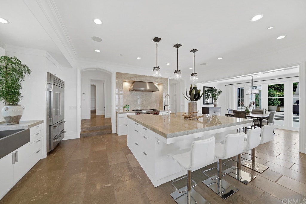9 Offshore Newport Coast, CA 92657 - Photo 34 of 75 a large kitchen with kitchen island a large island in it