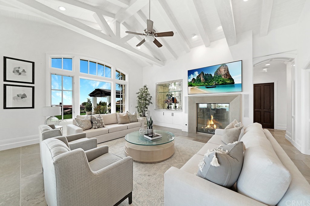9 Offshore Newport Coast, CA 92657 - Photo 38 of 75 a living room with furniture a fireplace and a large window