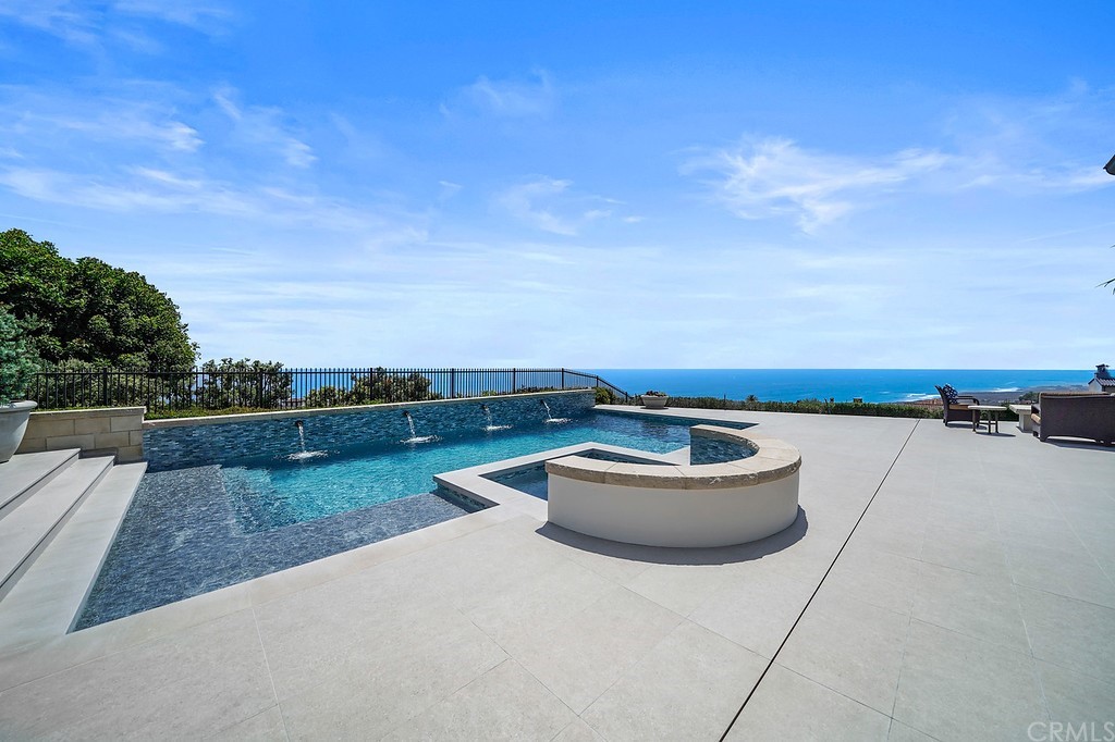 9 Offshore Newport Coast, CA 92657 - Photo 59 of 75 a terrace with outdoor seating and barbeque oven