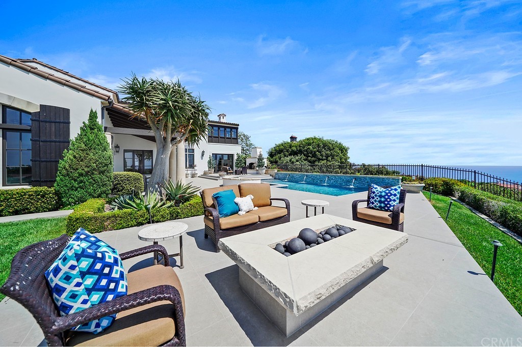 9 Offshore Newport Coast, CA 92657 - Photo 63 of 75 a view of a patio with couches table and chairs and potted plants