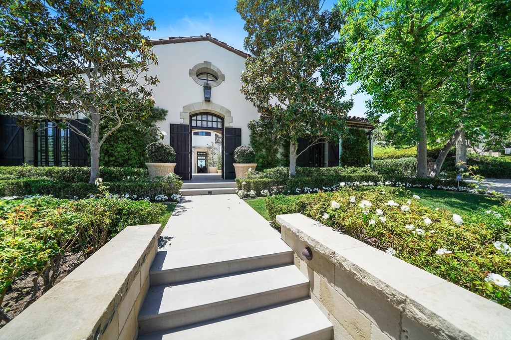 9 Offshore Newport Coast, CA 92657 - Photo 7 of 75 a front view of a house with garden