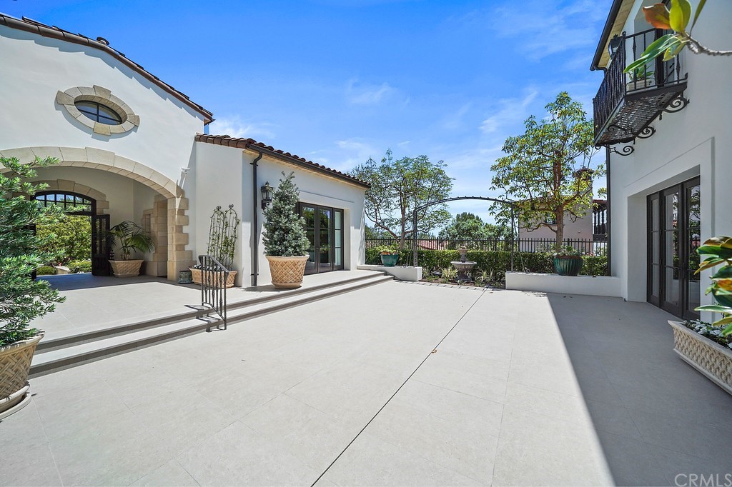 9 Offshore Newport Coast, CA 92657 - Photo 9 of 75 front view of a house with a porch
