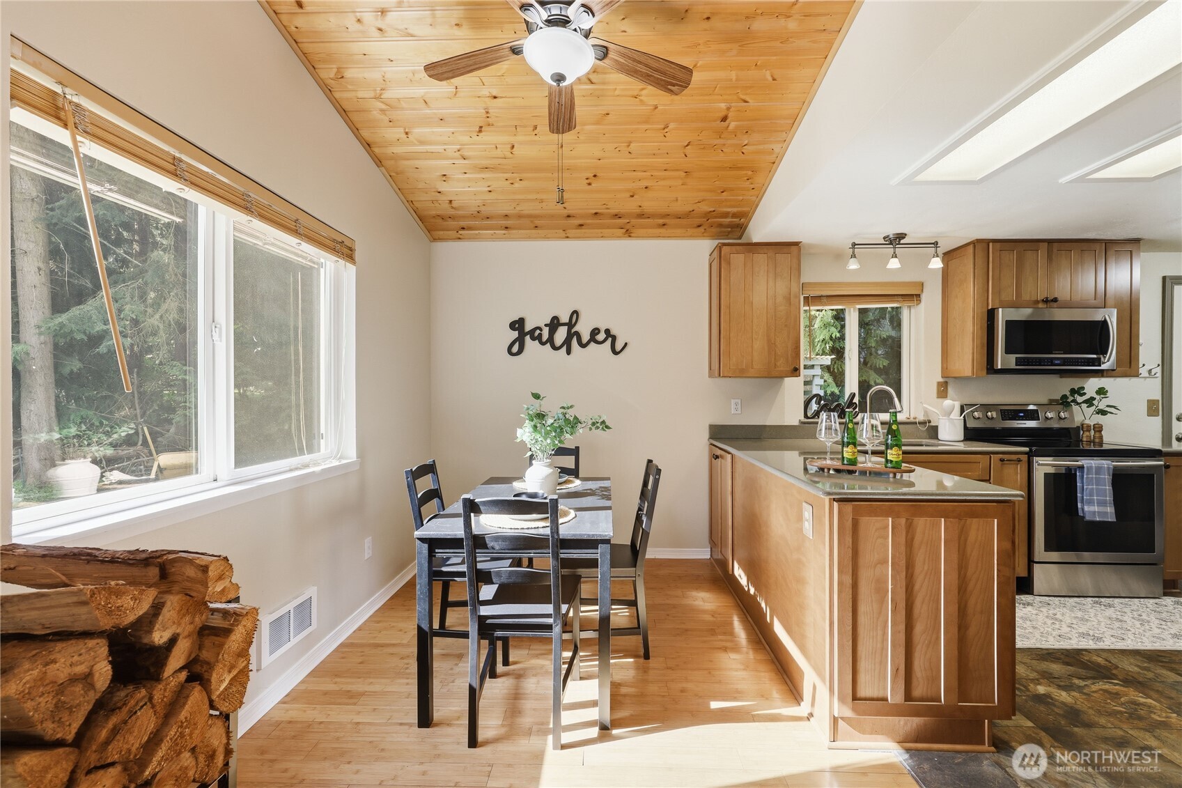 70 Salal Way Sequim, WA 98382 - Photo 17 of 36 a dining room with wooden floor and a chandelier