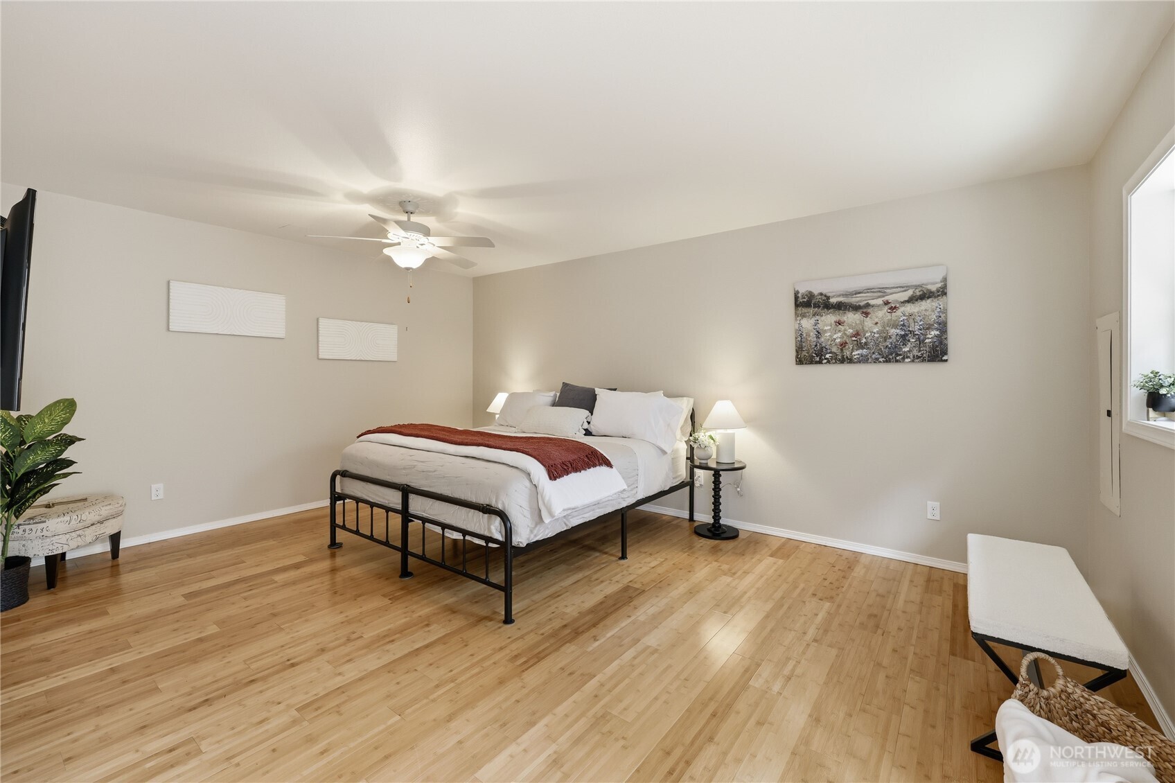 70 Salal Way Sequim, WA 98382 - Photo 18 of 36 a bedroom with a bed and a potted plant on the dresser