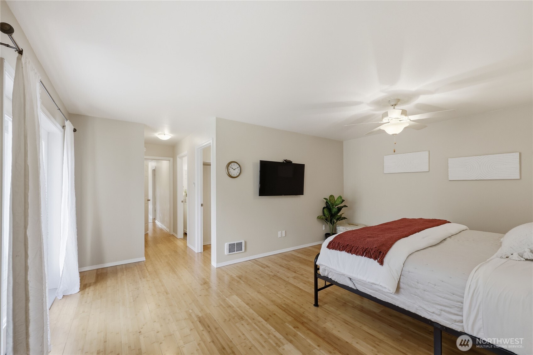 70 Salal Way Sequim, WA 98382 - Photo 19 of 36 a bedroom with a bed and a flat screen tv