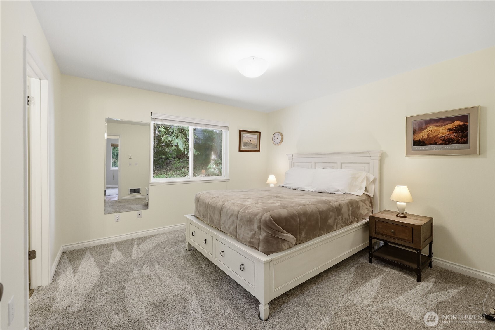 70 Salal Way Sequim, WA 98382 - Photo 21 of 36 a spacious bedroom with a bed and window