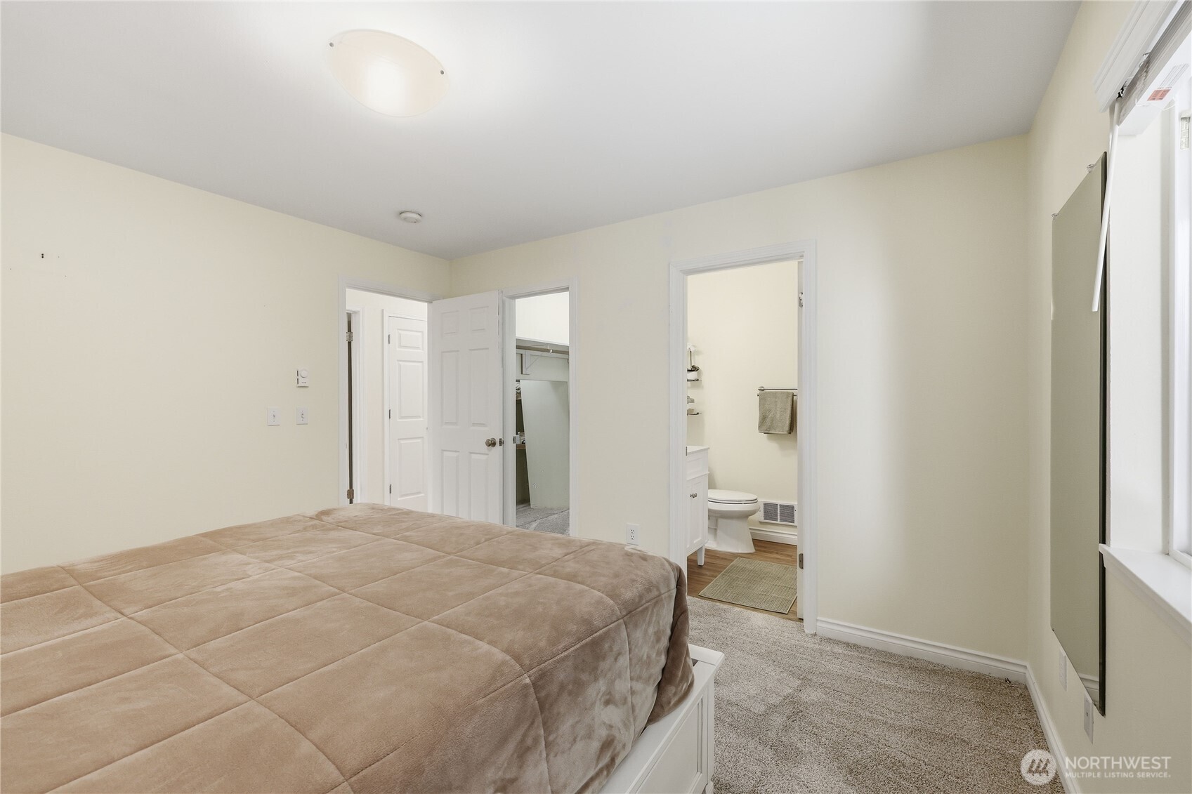 70 Salal Way Sequim, WA 98382 - Photo 22 of 36 a bedroom with a bed and cabinets