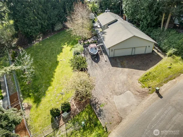 a aerial view of a house with a yard and garden