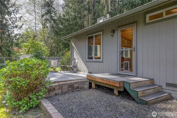 a backyard of a house with outdoor seating