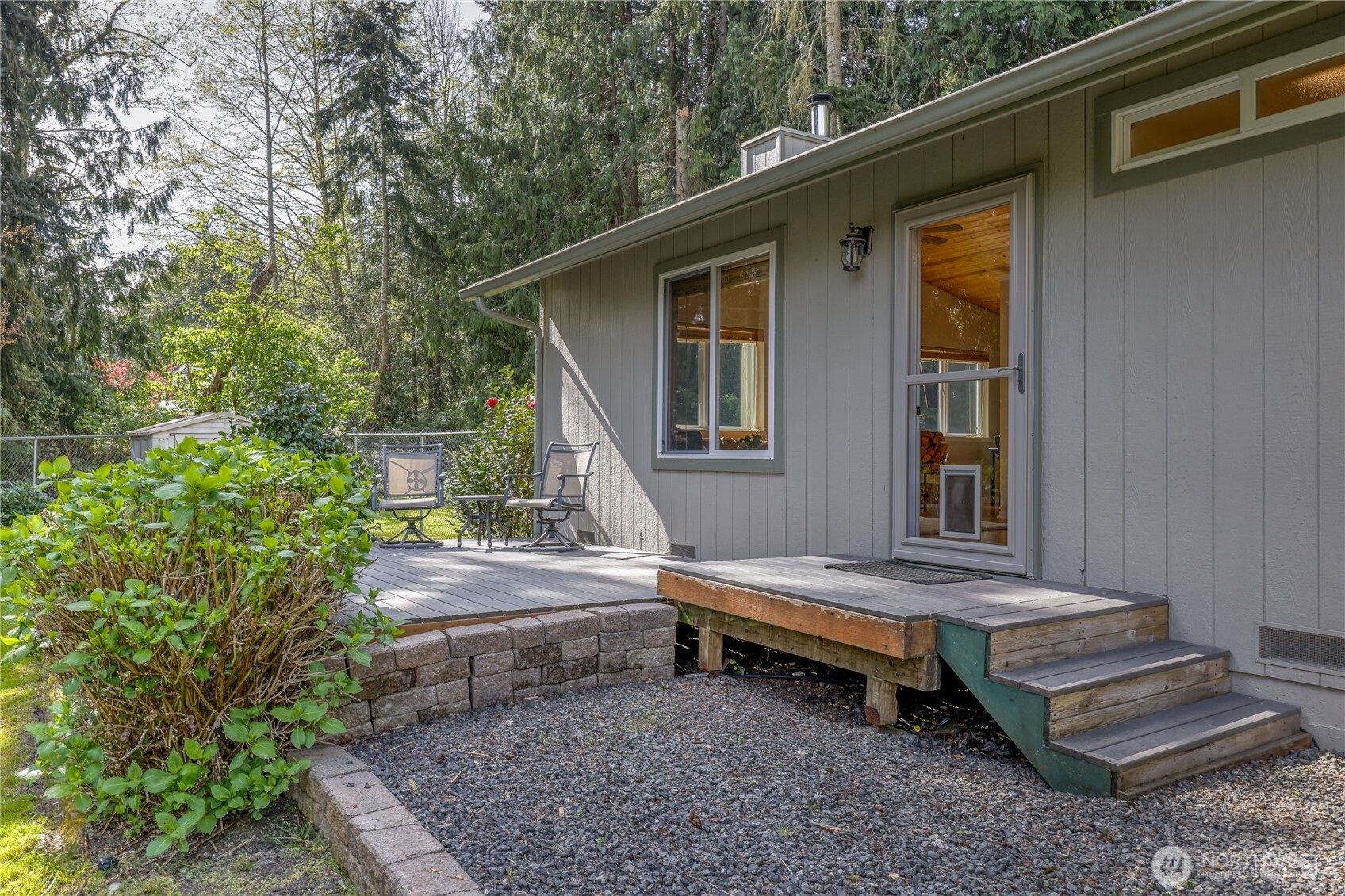 70 Salal Way Sequim, WA 98382 - Photo 10 of 36 a backyard of a house with outdoor seating