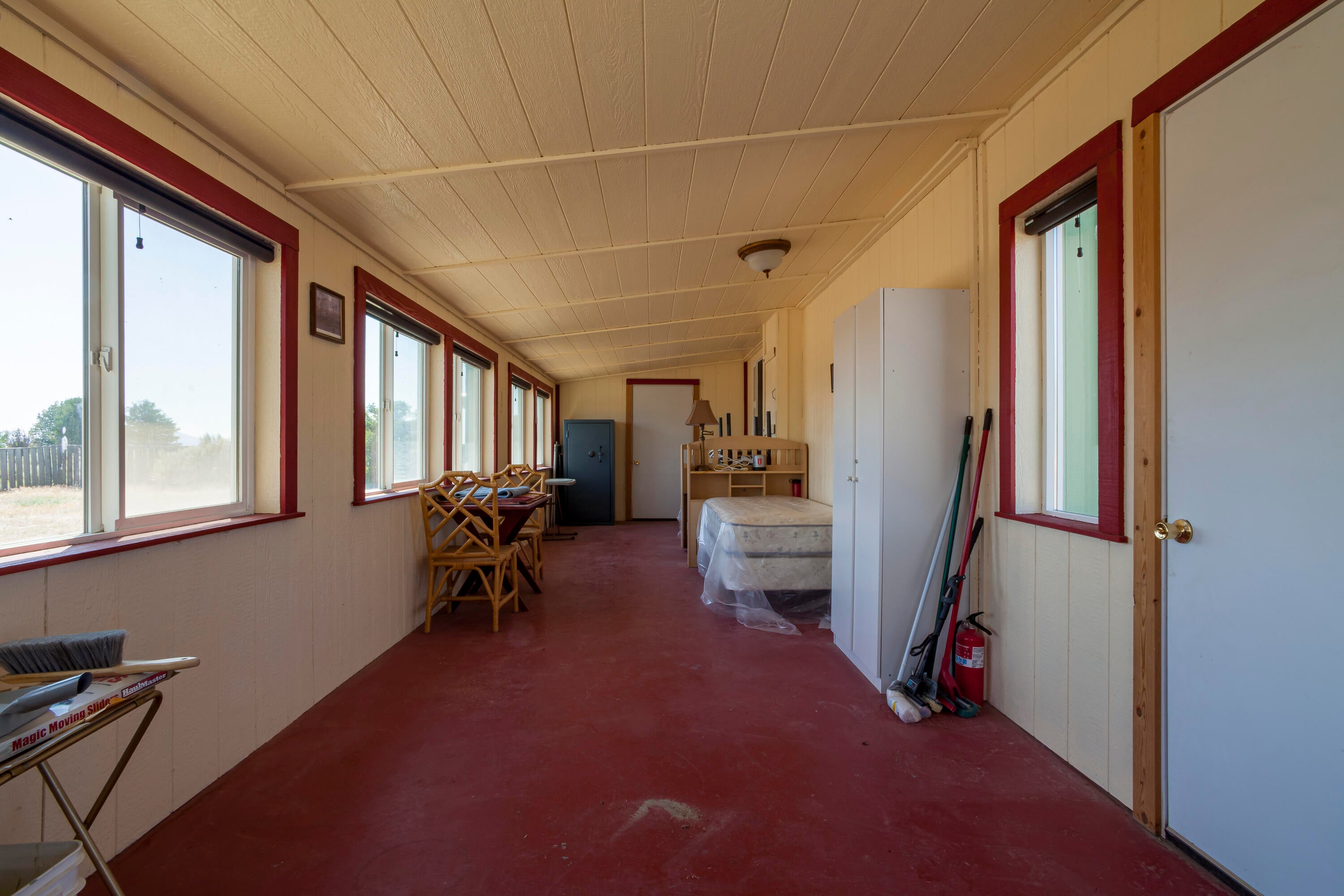 57282 Tinsel Road Christmas Valley, OR 97641 - Photo 36 of 54 The east end of the sunroom looking towards the west end.