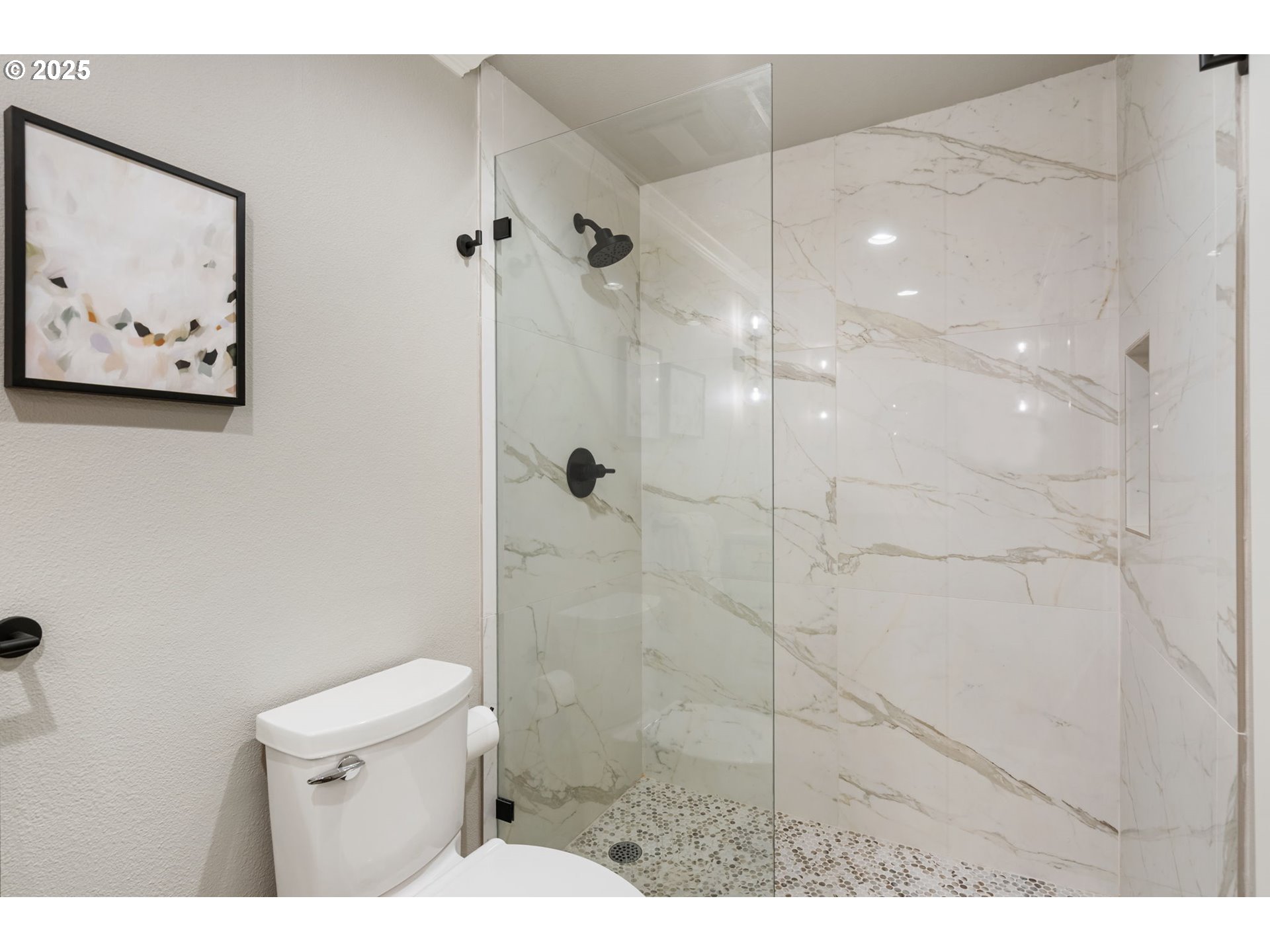 5620 South Riverside Lane, Unit 3 Portland, OR 97239 - Photo 11 of 41 a bathroom with a toilet and a shower