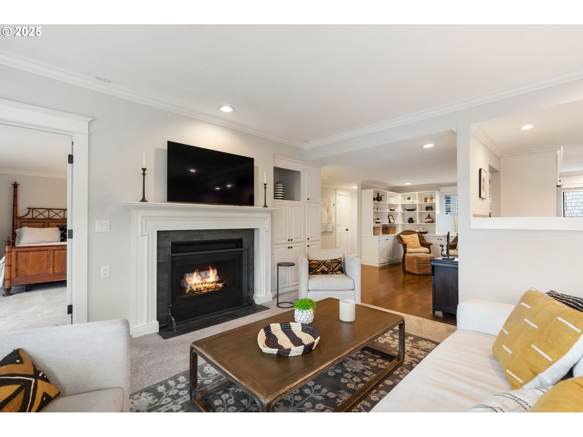 5620 South Riverside Lane, Unit 3 Portland, OR 97239 - Photo 16 of 41 a living room with furniture a fireplace and a flat screen tv