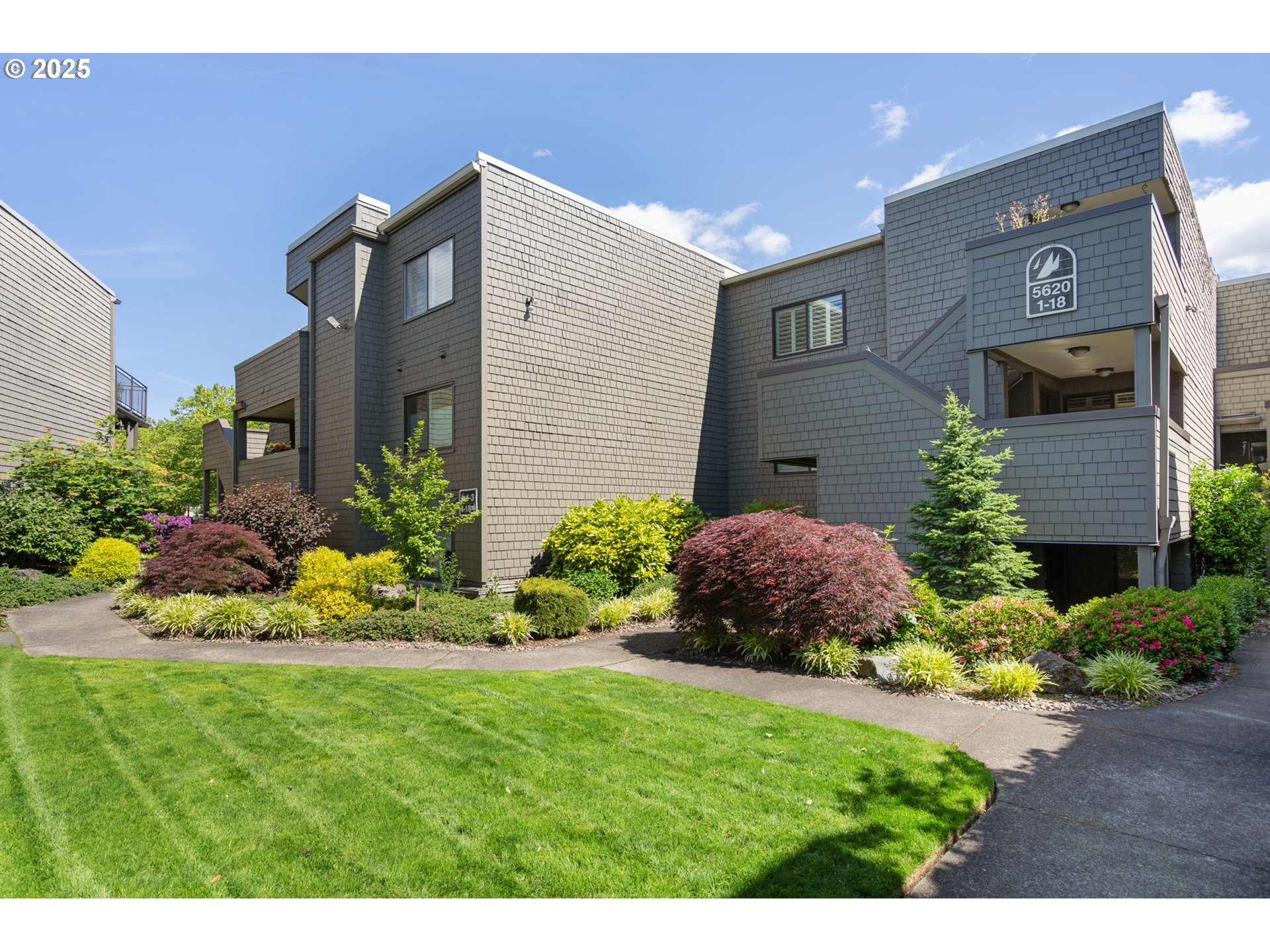 5620 South Riverside Lane, Unit 3 Portland, OR 97239 - Photo 2 of 41 a view of a house with a yard and garden