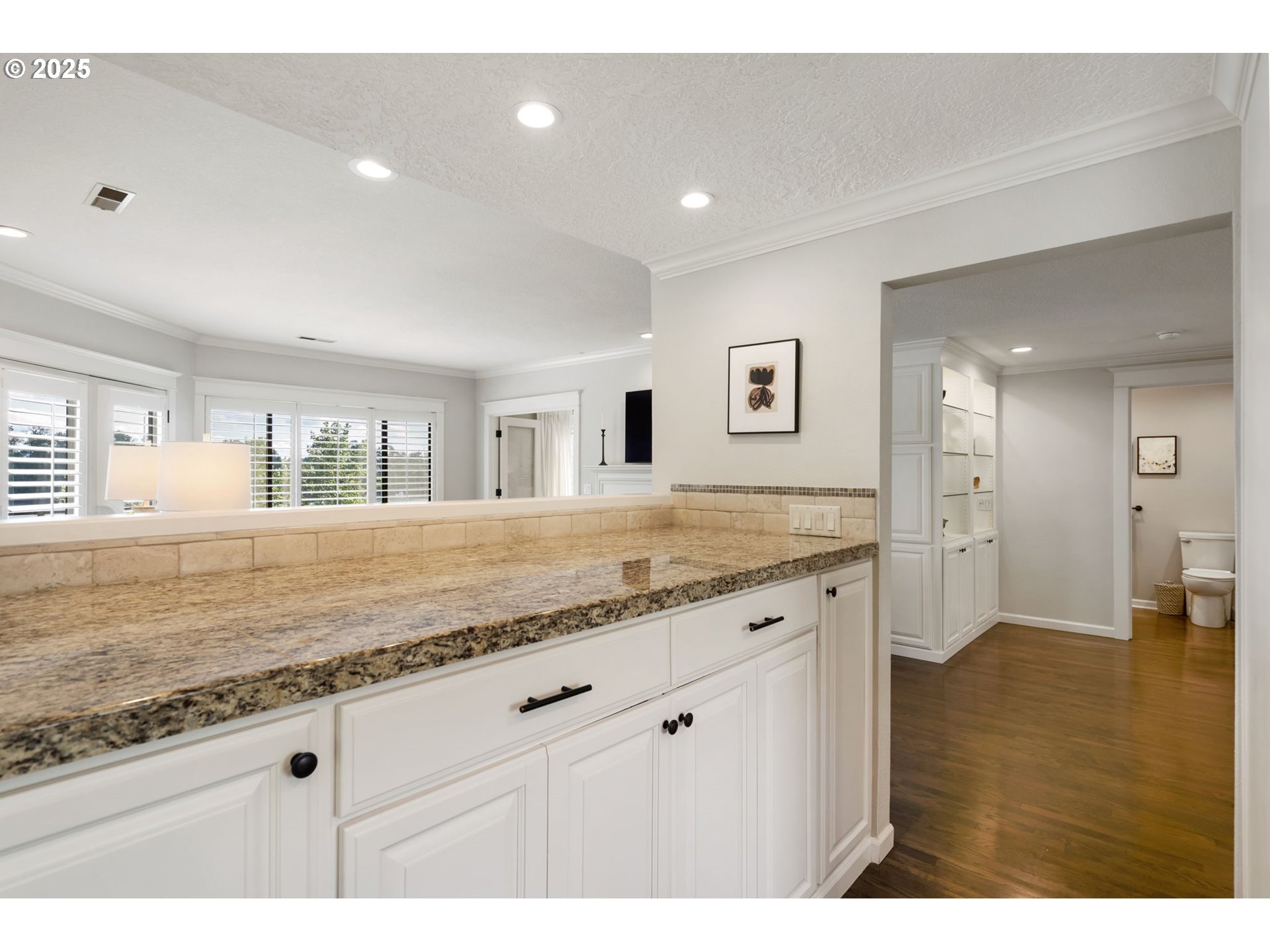 5620 South Riverside Lane, Unit 3 Portland, OR 97239 - Photo 26 of 41 a kitchen with granite countertop sink and cabinets