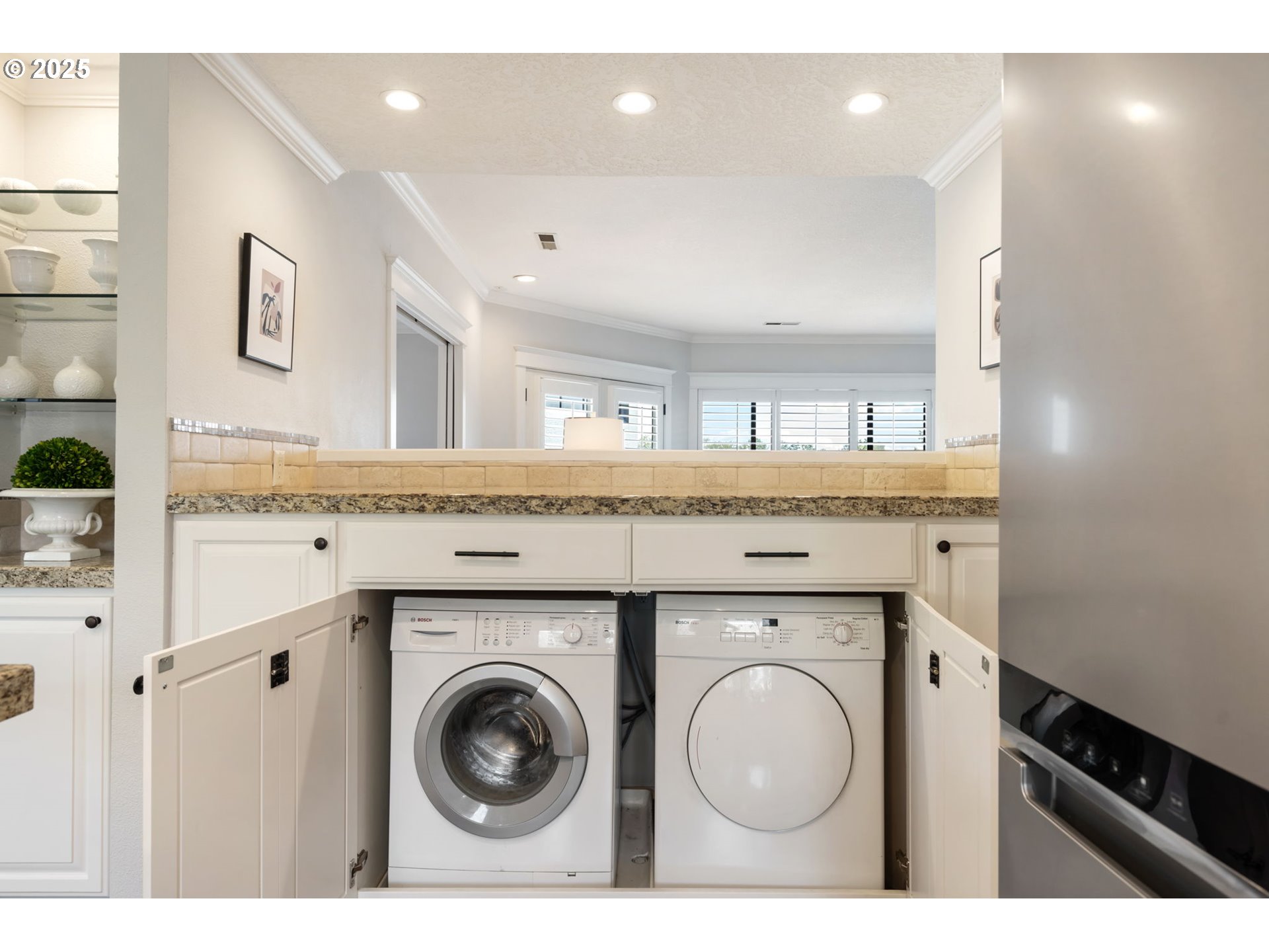 5620 South Riverside Lane, Unit 3 Portland, OR 97239 - Photo 27 of 41 a bathroom with a granite countertop sink and a mirror