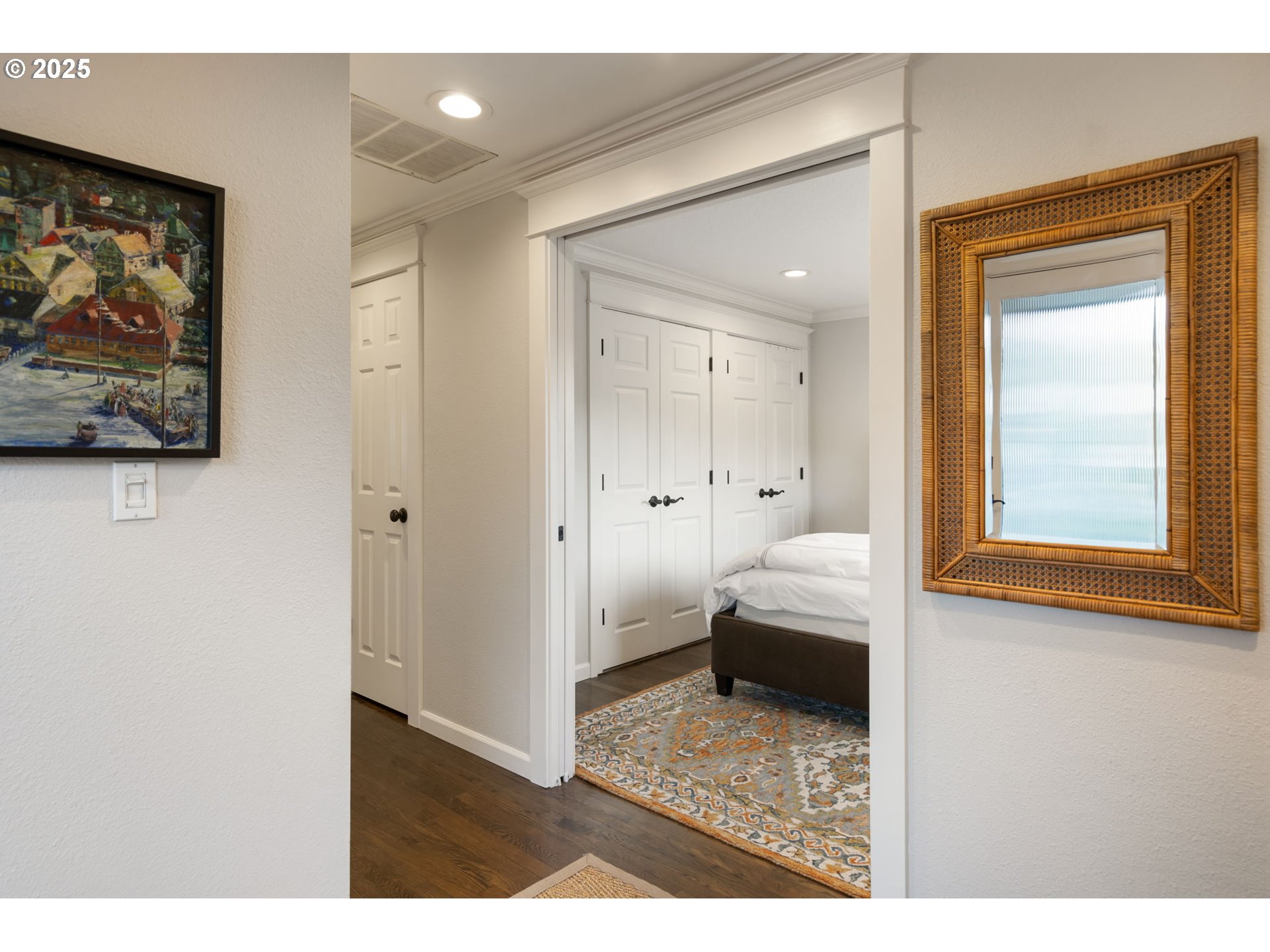 5620 South Riverside Lane, Unit 3 Portland, OR 97239 - Photo 6 of 41 a bedroom with a bed and a painting on the wall