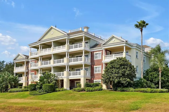 a living room with fireplace furniture and a large window