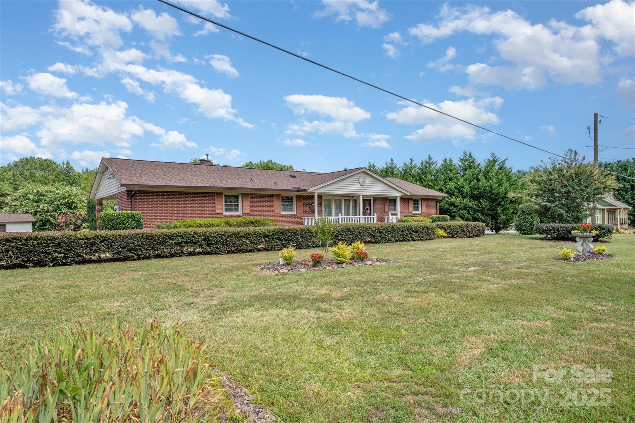 a front view of house with yard outdoor seating and barbeque oven