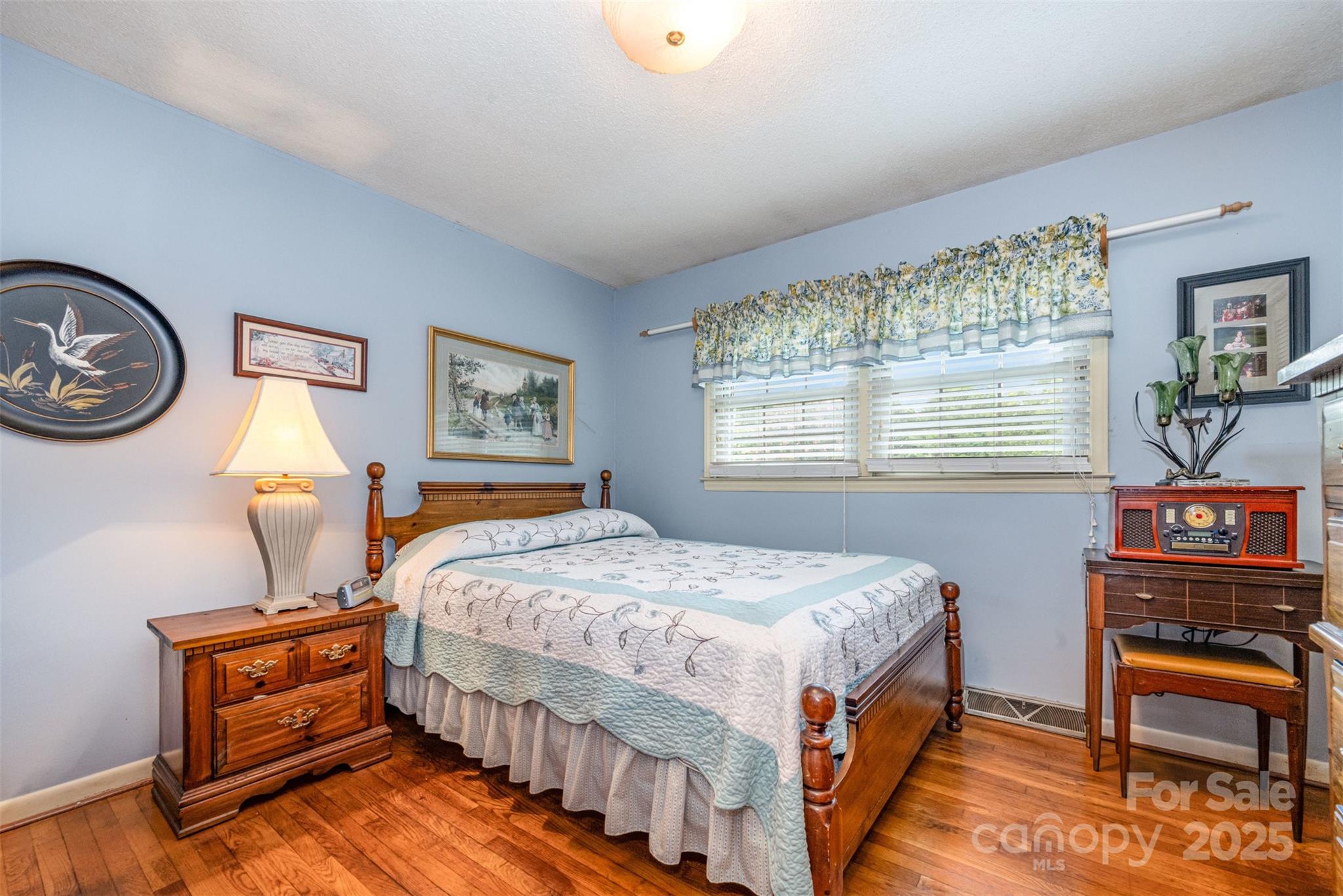 2236 Old Hickory Grove Road Mount Holly, NC 28120 - Photo 15 of 27 a bedroom with a bed a dresser and a window