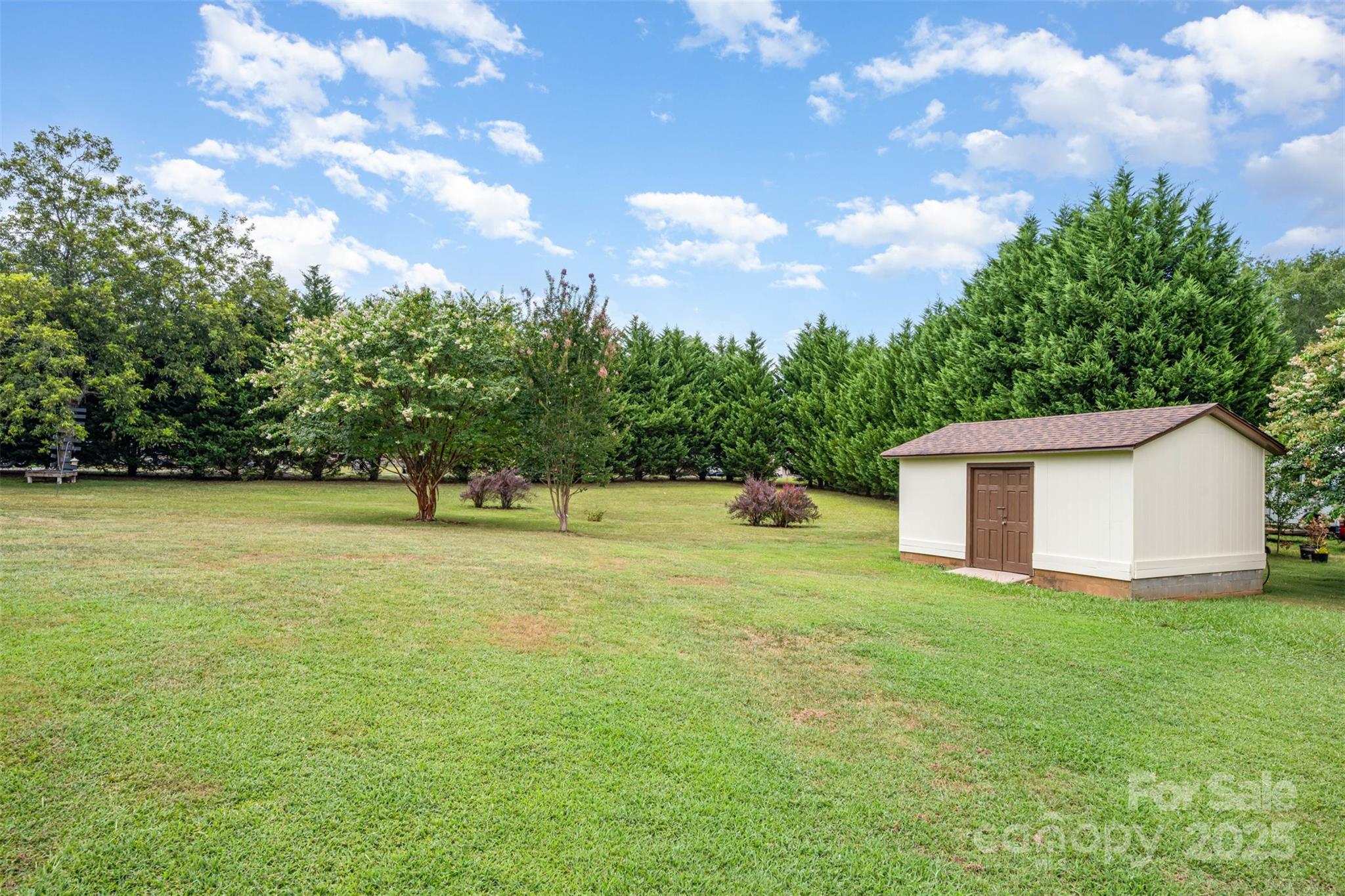 2236 Old Hickory Grove Road Mount Holly, NC 28120 - Photo 25 of 27 a view of a house with a yard