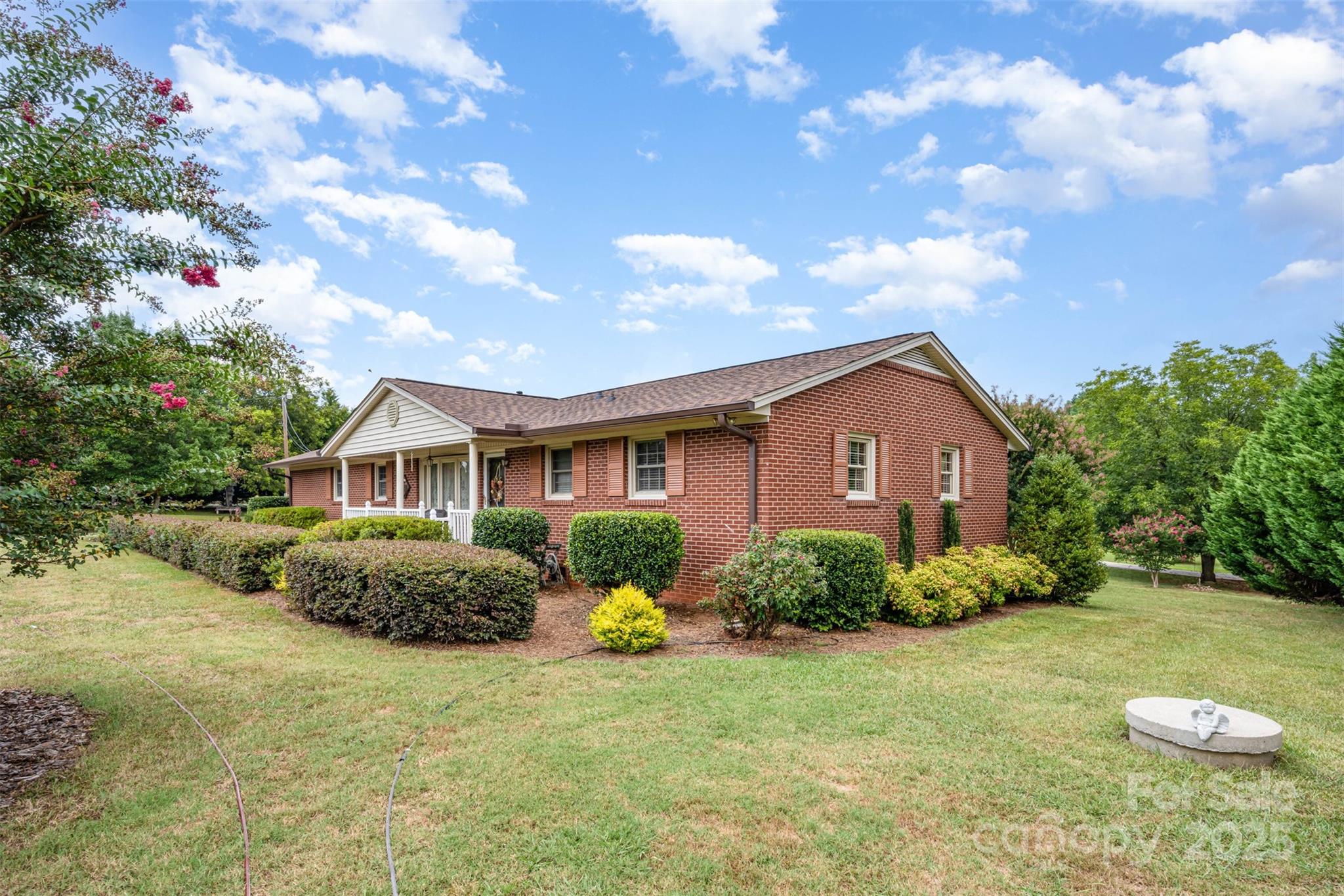2236 Old Hickory Grove Road Mount Holly, NC 28120 - Photo 3 of 27 a front view of a house with garden