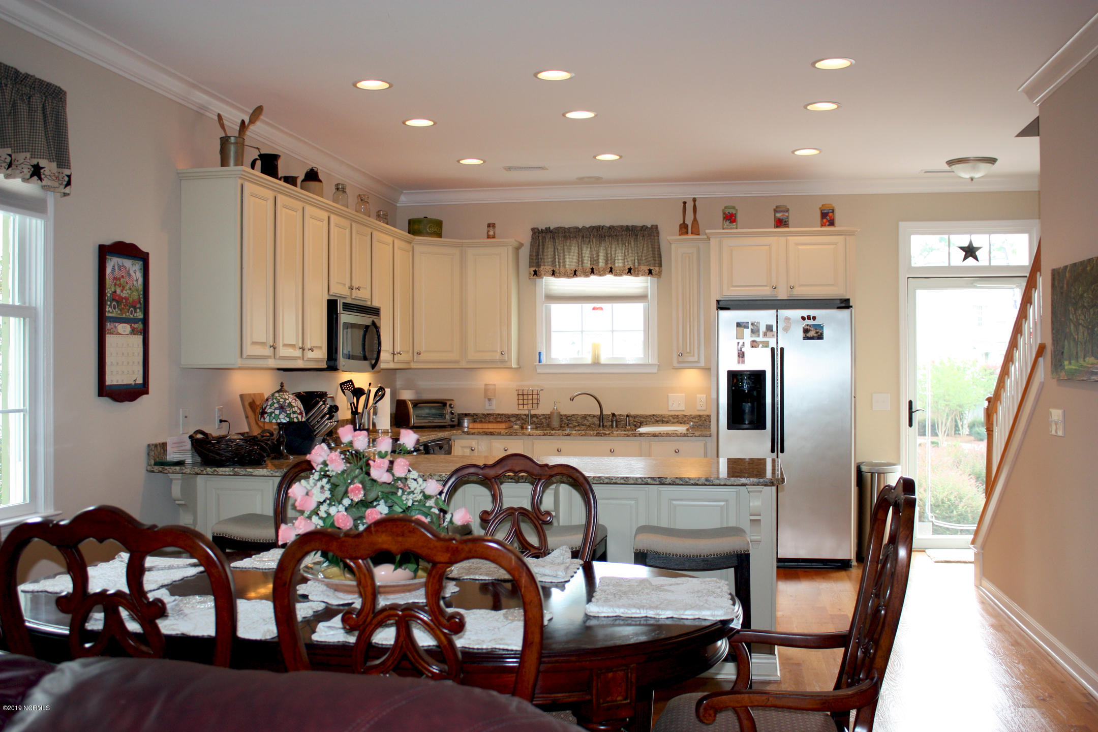 587 River Ridge Road, Unit 6 Shallotte, NC 28470 - Photo 7 of 34 LR to Dining and Kitchen w storm door fr