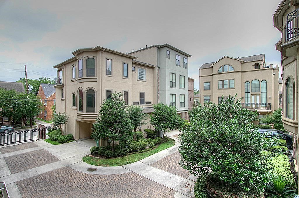 622 Bomar Street Houston, TX 77006 - Photo 11 of 21 a white building with a clock on the side of it