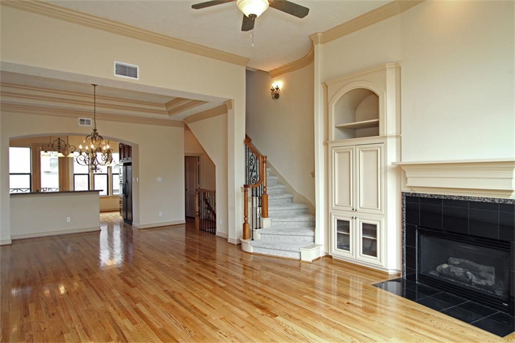 622 Bomar Street Houston, TX 77006 - Photo 5 of 21 a view of empty room with stairs and wooden floor