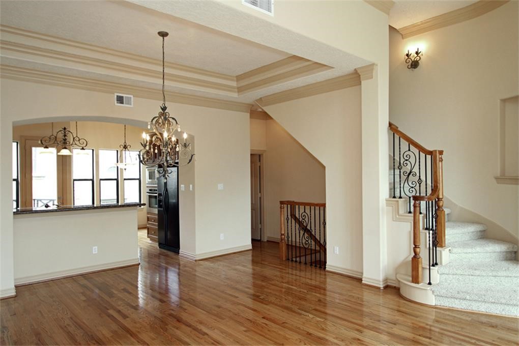 622 Bomar Street Houston, TX 77006 - Photo 6 of 21 a view of a room with wooden floor chandelier and entryway
