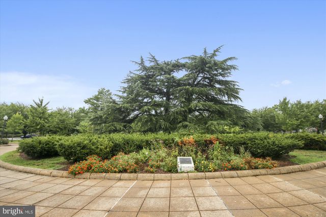 a view of backyard with outdoor seating and stairs