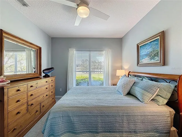 a view of a dining room kitchen with furniture and a chandelier
