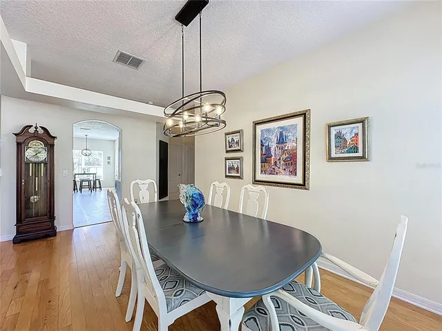 a kitchen with stainless steel appliances a stove a sink and a microwave