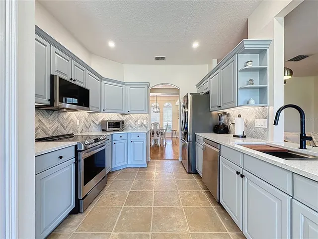 an aerial view of a house with outdoor space and lake view