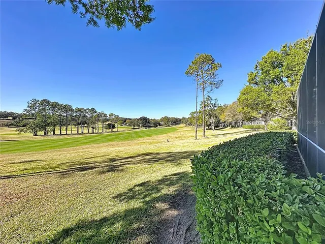 a lobby with furniture and a flat screen tv